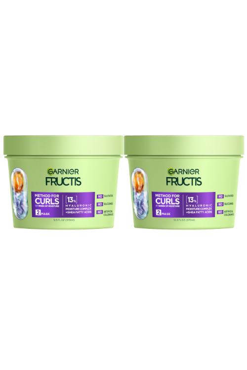 Two light green tubs of Garnier Fructis Method for Curls Mask are displayed. Each tub is labeled "METHOD FOR CURLS UP TO 1 WEEK OF MOISTURE," indicating it's a "MASK" with "13% HYALURONIC MOISTURE COMPLEX + SHEA FATTY ACIDS." It also states "NO SULFATES, NO SILICONES, NO ARTIFICIAL COLORANTS."